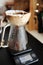 Unusual creative coconut shell pourover drip alternative coffee brewing on timer scale