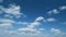 Unusual cumulus and stratocumulus clouds in blue sky. Wide angle contrast daytime nature background. Timelapse.