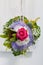 Unusual floral posy incorporating a blue textile