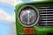 Unusual front headlight, old green car