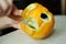 Unusual Halloween melon, cutting process, knife and male hands