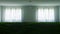 Unusual illustration of a large white room, with a lawn inside and a small light bulb