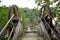 An unusual interesting hinged bridge over a mountain river