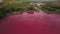 Unusual landscape with pink lake, aerial view, ecological catastrophe