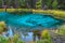 An unusual magical and mysterious geyser lake of turquoise color