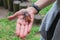 Unusual pets concept. Central American giant cave cockroach, Blaberus giganteus on the woman`s hand. One of the largest