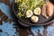 Unusual salad with radish sprouts, quail eggs and anchovies