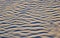 Unusual sand dune resembling a swell on the surface of the water