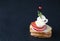 Unusual sandwich - a traditional Spanish tapas food consisting of radish, tomato, half quail egg, squid, and rosemary on