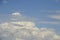 Unusual sky - billowing white clouds in blue teal sky with horizontal grey whispy almost transparent  clouds in foreground