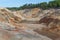 Unusual surreal alien landscape. Orange mountains. Ural refractory clay quarries