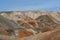 Unusual surreal alien landscape. Orange mountains. Ural refractory clay quarries