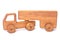 Unusual  wooden dump truck on a white background alder tree with smooth edges