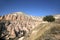 Unusually shaped volcanic rocks in the Pink Valley near the village of Goreme in the Cappadocia region