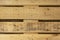 unvarnished light wood plank surface with many grains and saw marks