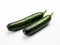 Unveiling the Minimalist Elegance: Two Cucumbers Against a Pristine White Canvas