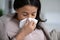 Unwell biracial woman have fever at home