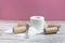 Unwound roll of soft white toilet paper among empty toilet paper rolls