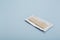 Unwrapped stick of chewing gum on light grey background. Space for text