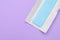 Unwrapped stick of chewing gum on violet background, top view. Space for text