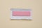 Unwrapped stick of tasty chewing gum on beige background, top view