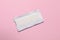 Unwrapped stick of tasty chewing gum on pink background, top view