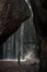 Uoung woman backpacker looking at the waterfall in jungles. Ecotourism concept image travel girl. Bali island, Indonesia