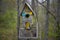`up on 110st` dilapidated bird house with dichroic glass windows