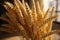 An up close, 3D wheat bundle resembling an artful wheat bouquet