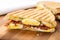 up-close of a grilled bacon and egg breakfast panini