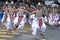 Up Country Dancers perform to the beat of drummers along the streets of Kandy during the Day Perahera in Sri Lanka.