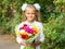 Up portrait of seven-year school girl with a bouquet of flowers