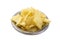 Up View Crispy thinly sliced potato chips in white bowl, on white background.