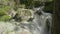 Up view of waterfall in ravine Makhar. Close up view