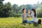 Upbeat mother and daughter playing pat-a-cake outdoors