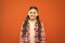 Upbringing versatile personality. Wellbeing and health. Childhood concept. Girl child stand orange background. Happy