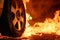 upclose view of a car tire melting in intense flames