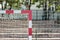 Upper corner of a goal post and bar in an outdoor football field