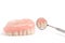 Upper dentures and dental mirror on white background,Selective f