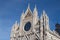 Upper facade detail of Duomo di Siena or Metropolitan Cathedral of Santa Maria Assunta. Tuscany. Italy.