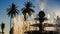 Upper jet of round cascade fountain sprays in tropical park