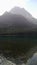 Upper Kintla Lake Glacier National Park in Montana. Beautiful reflection in lake flanked by forest of trees and mountain peaks