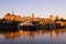 Upper and lower old town skyline seen from the Louise Basin during a golden hour dawn