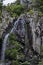 Upper and middle part of fresh Boyana waterfalls in deep forest and rock, Vitosha