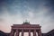 Upper part of brandenburg gate in berlin on a colorful evening with picturesque clouds. Colossal monument in berlin