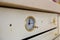 The upper part of The oven in the style of Provence. Close-up temperature dial indicator