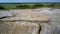 Upper view flat part of clay quarry with watching tower