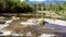 Upper view mountain river with bare stones