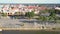 Upper view river embankment against red roof buildings