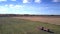 Upper view truck with trailer drives along harvested field